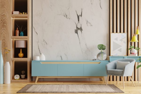 Living room interior with armchair and cabinet for tv on empty marble wall background.3D rendering